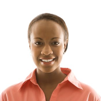 Portrait of African American woman smiling against white background.