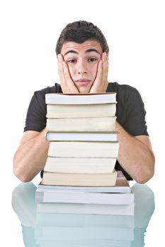 Portrait of a stressed young student with a pile of books to read.