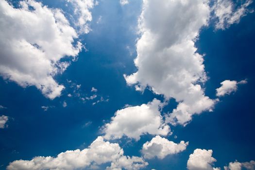 Sunny blue sky with big clouds.