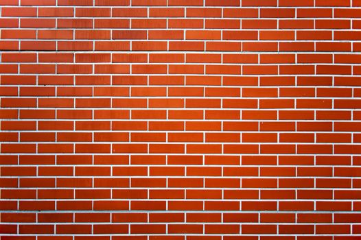 Photo of a red brick wall pattern.