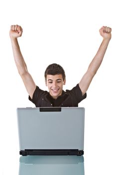 Young man, celebrating on his laptop. Isolated on white background.