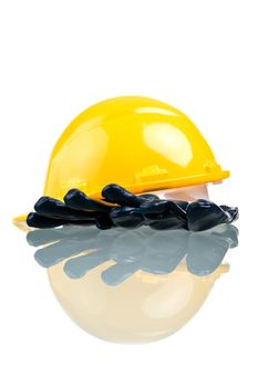 Construction hat and gloves, isolated on white background with reflection.