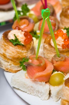 delicious seafood canapes with salmon and red caviar