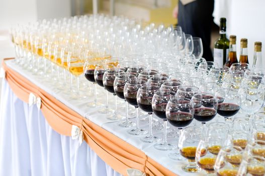 many wine glasses on the banquet table, selective focus, very shallow DOF