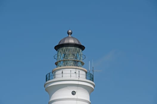 The top of a white lighthouse dome