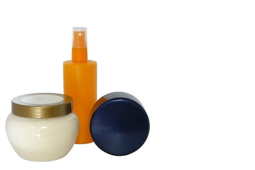 Different bottles of cream for skin and make-up