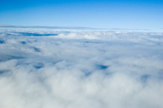 Aerial photo, showing beautiful skyscape. Blue sky covered with differnet clouds.