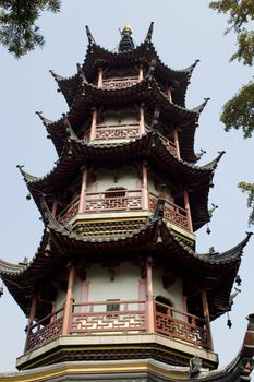 Ancient, traditional tower with typical wooden roof in Nantong city, Jiangsu province, China.