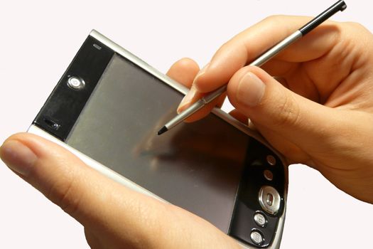 Pda organizer in persons hand with stylus