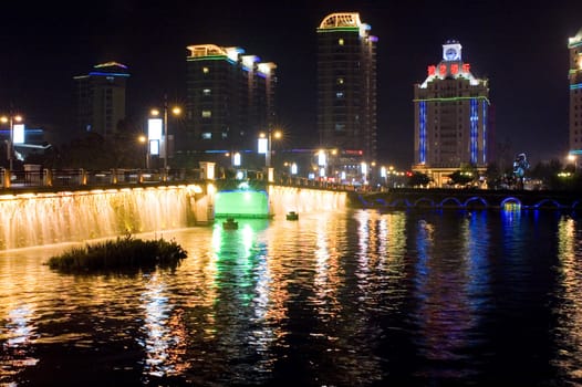 Nightscape of Nantong city, Jiangsu province, China. Wonderful cityscape with famous Haohe river. 