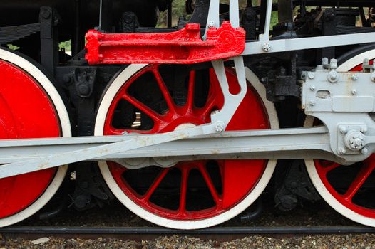 Fragment of old (retro) steam engine (locomotive) - driving wheels.