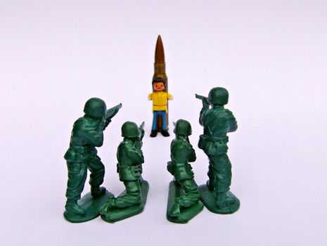 Staging of a firing squad, using plastic toys and a real bullet (actually the bullet is harmless, without gunpowder inside).