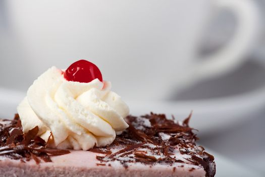 cherry cake and a cup of coffee