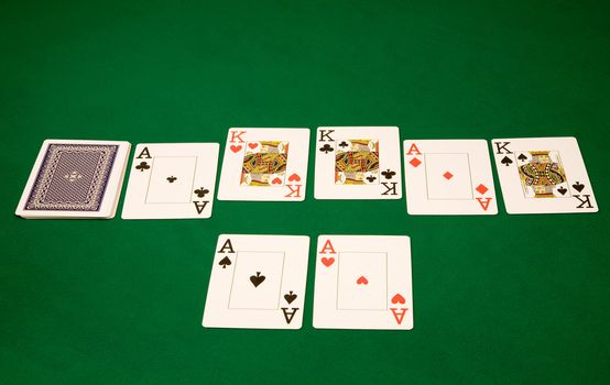 Good card on winning hand in poker at casino on green table