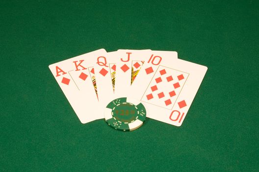 Royal flush on the green casino table