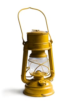 Yellow Kerosene lamp or paraffin lamp isolated on white. Clipping path included