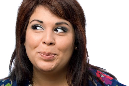 A Hispanic woman isolated over white with a mischievous look on her face.