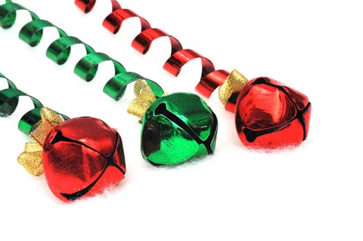 Red and green bells on a light fuzzy background