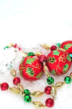 Christmas tree decorations on a white snowy background