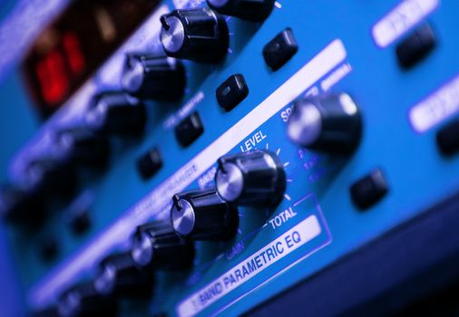 close-control panel of a mixer in a recording studio