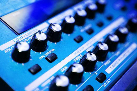 close-control panel of a mixer in a recording studio