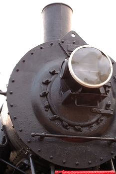 Old (retro) steam engine (locomotive) on isolated background.