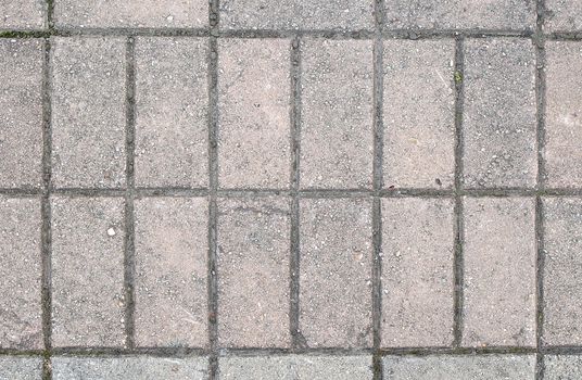 Old paving blocks (stones) - street pavement background (texture).