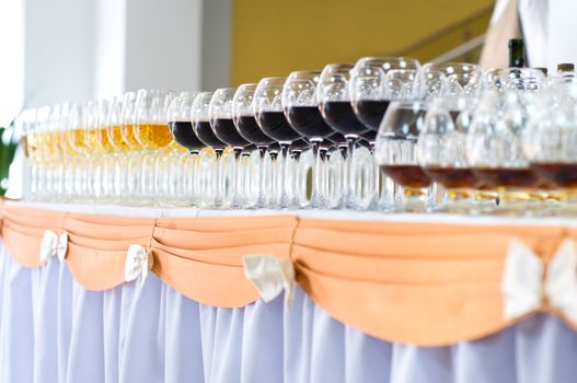 many wine glasses on the banquet table, selective focus, very shallow DOF