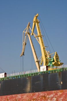 transportation series:  crane of dry cargo ship in the port
