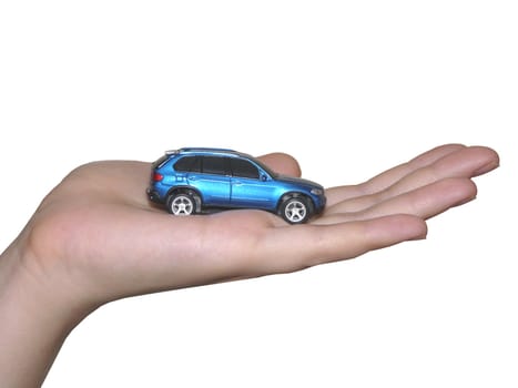 A small car in a person`s hand