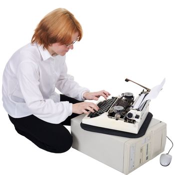 The girl printing on an ancient typewriter