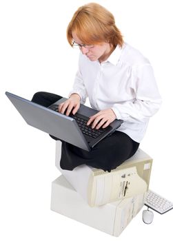 The girl working on the black laptop on a white background