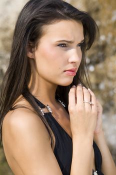 nice fashion portrait of a young and beautiful girl with black hair