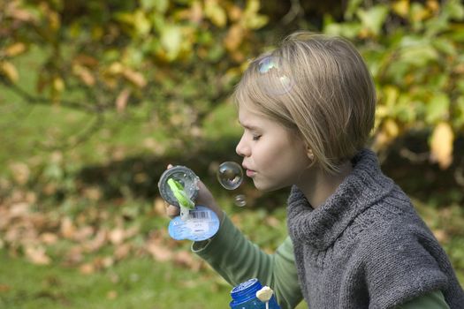 a little girl playing in the open air