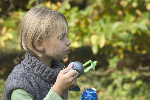 a little girl playing in the open air