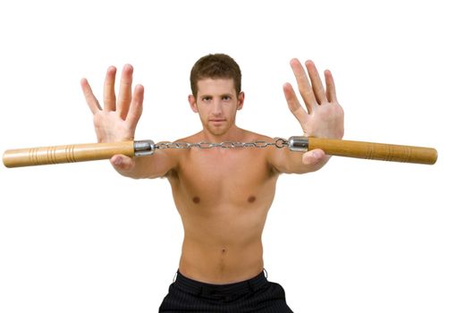 young male holding nunchaku with open palms on isolated background