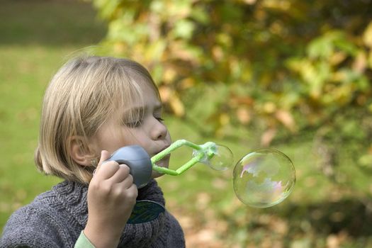 a little girl playing in the open air