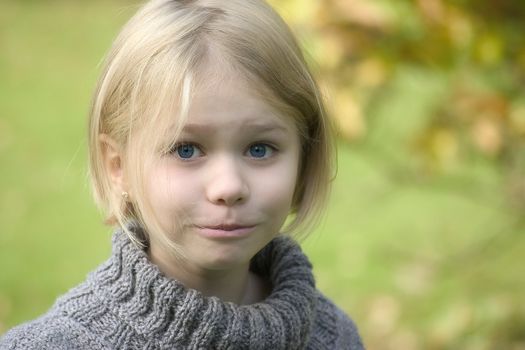 Portrait of girl in the open air, blurred background