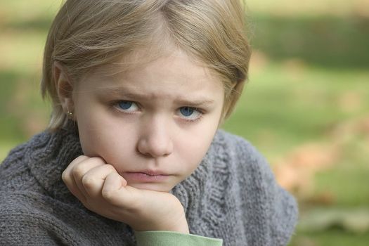 Portrait of girl in the open air, blurred background