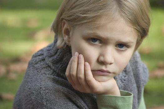 Portrait of girl in the open air, blurred background