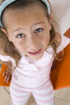 aerial view of smiling sweet little girl