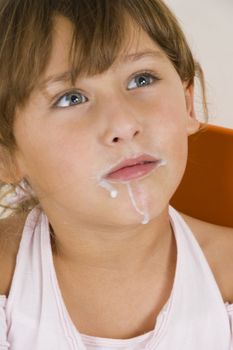 little girl with milk mustache  looking upward