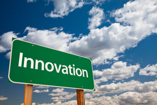 Innovation Green Road Sign with Copy Room Over The Dramatic Clouds and Sky.