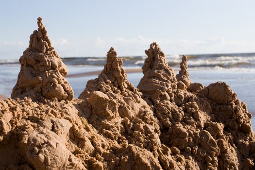 Towers of sand castle at the seaside