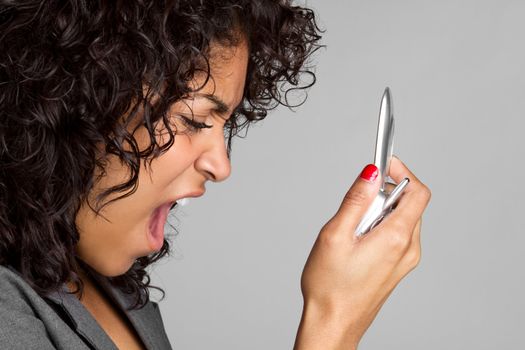 Black woman yelling into phone