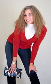 happy young girl against light wall