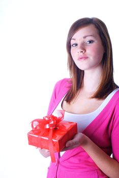 Pretty girl holding nice wrapped gift; isolated on white.               