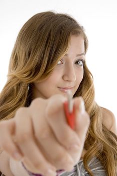 beautiful teen girl showing key to camera on  an isolated white background 