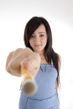 attractive teenager showing pencil to camera on  an isolated white background 