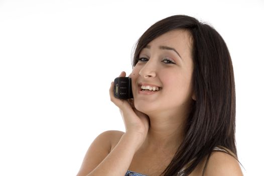 happy teenager talking on mobile phone on  an isolated white background 